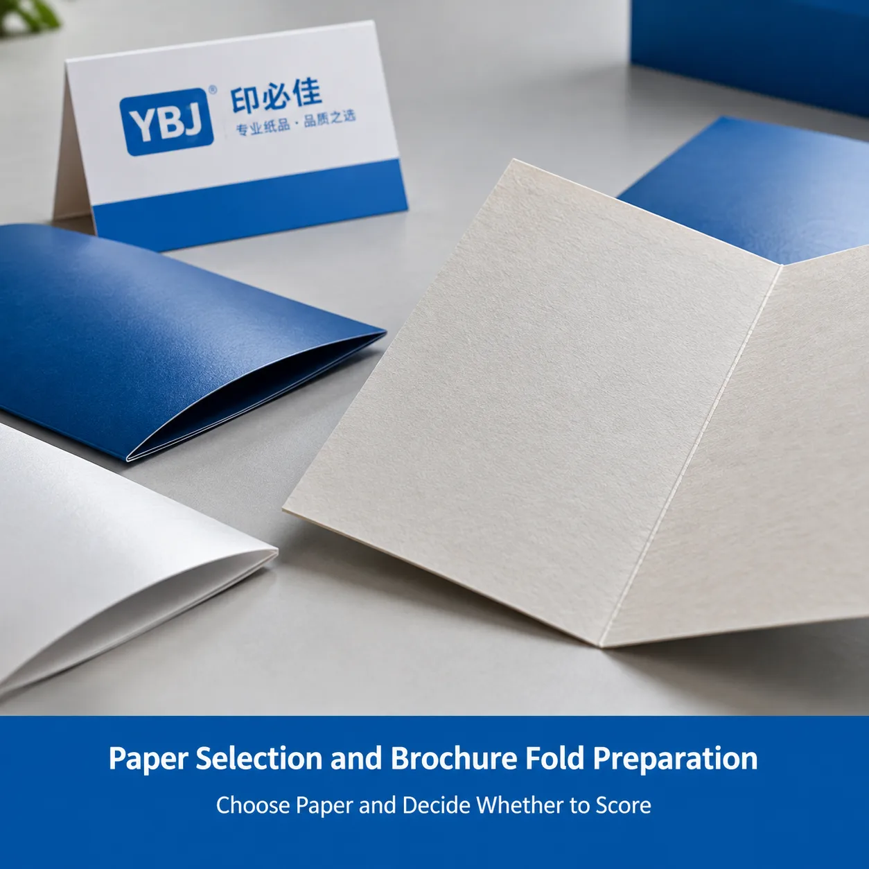 Close-up of folded paper samples illustrating paper texture, thickness and fold preparation.